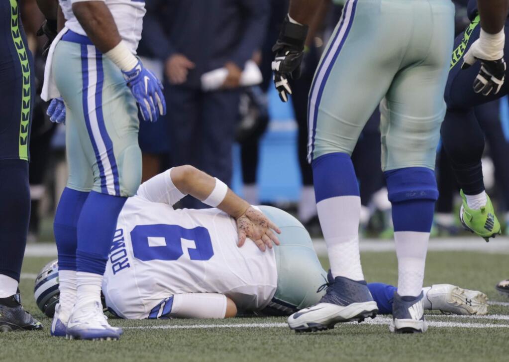 Dallas Cowboys quarterback Tony Romo broke his back in a 2016 preseason game, which ultimately led to the end of his playing career. (AP Photo/Stephen Brashear)