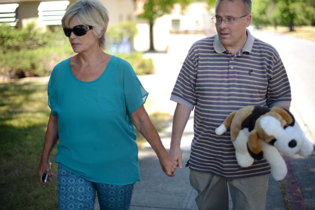 Kathleen Miller with her son, Danny Smith, walking near the housing units of the Sonoma Developmental Center in Eldridge.