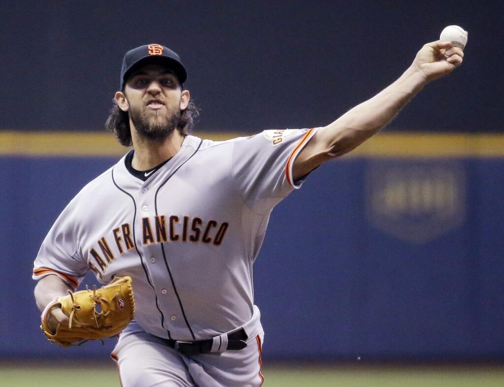 San Francisco Giants starting pitcher Madison Bumgarner throws during the first inning of a baseball game against the Milwaukee Brewers Tuesday, May 26, 2015, in Milwaukee. (AP Photo/Morry Gash)