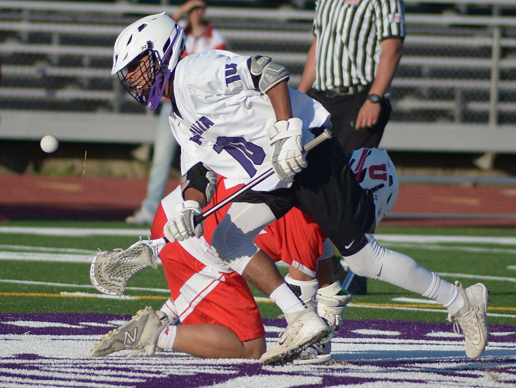 SUMNER FOWLER/FOR THE ARGUS-COURIERIsaiah Blomgren is off and running after winning another face off for Petaluma in its overtime win against University in the first round of the North Coast Section playoffs.
