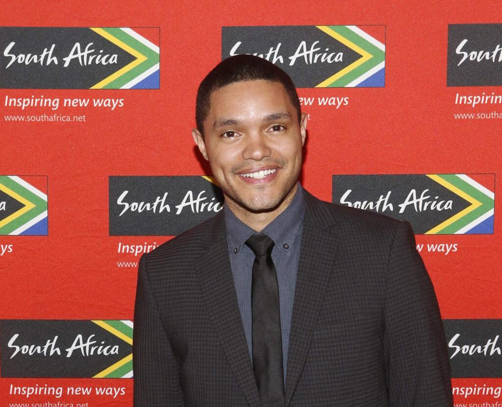 FILE - In this April 13, 2015 file photo, Trevor Noah, South African comedian and new host of 'The Daily Show' on Comedy Central, poses at South African Tourism's sixth annual Ubuntu Awards, at the American Museum of Natural History in New York. Comedy Central says Sept. 28, 2015 will be opening night for Noah, when the 31-year-old will be stepping into the job held by Jon Stewart since 1999. (Jason DeCrow/South African Tourism via AP)