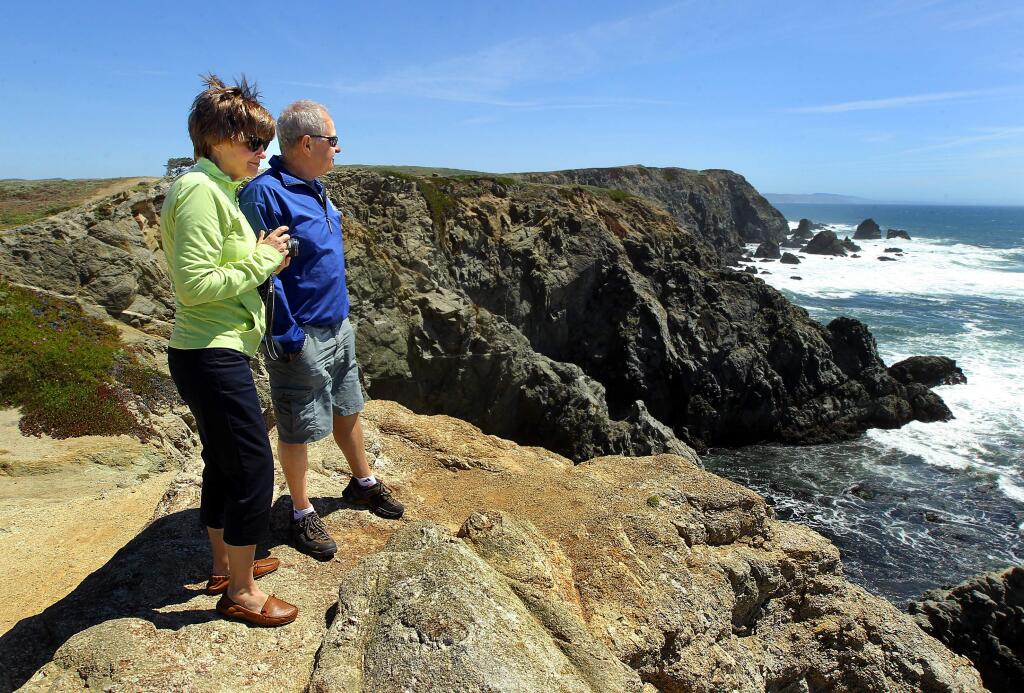 Debra and Carmine Dantonio enjoy the view from Bodega Head on Wednesday afternoon. The California Coastal Commission will decide whether to impose a day use fee on more than a dozen coastal beaches including Bodega Head. (Photo by John Burgess)
