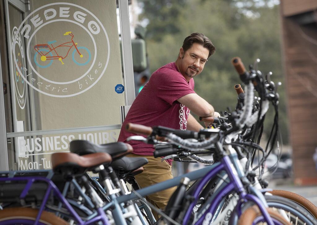 Colin Thomas opened the Pedego Electric Bicycle store in downtown Santa Rosa hoping to appeal to the older biker who needs a little help from an electric motor. (photo by John Burgess/The Press Democrat)