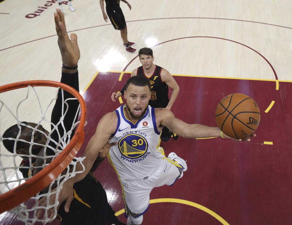 Steph Curry of the Warriors shoots against LeBron James of the Cavs during Game 4 of the NBA Finals in Cleveland. The Warriors defeated the Cavaliers 108-85 to clinch their third championship in four years. (KYLE TERADA / Pool photo via AP)