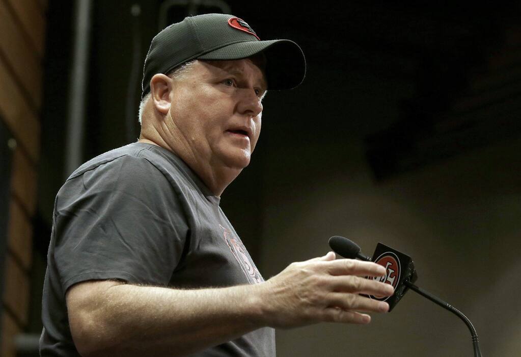 49ers Chip Kelly speaks to reporters before practice at the team's training facility in Santa Clara. (Jeff Chiu / Associated Press)