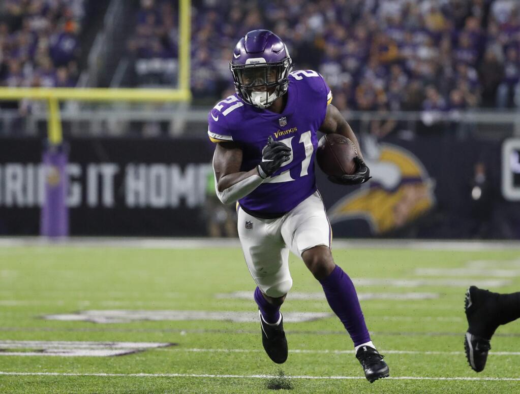 Minnesota Vikings running back Jerick McKinnon runs to the end zone for a touchdown against the New Orleans Saints during the first half in Minneapolis, Sunday, Jan. 14, 2018. (AP Photo/Jeff Roberson)