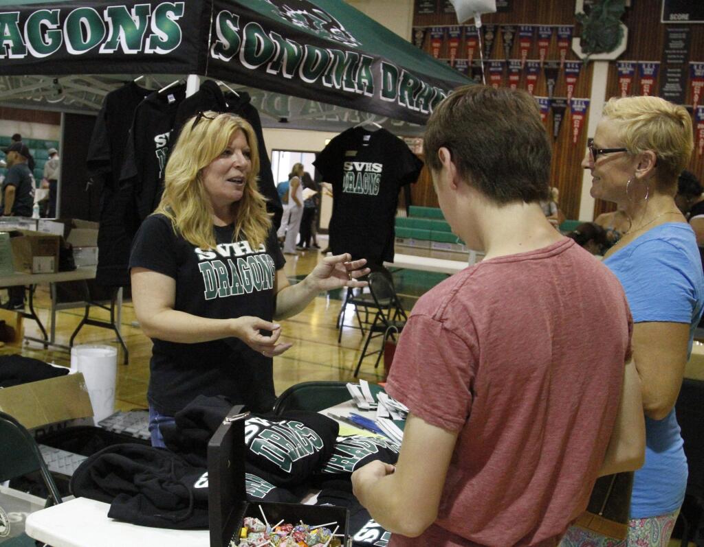 Bill Hoban/Index-Tribune file photoRegistration for Sonoma Valley High students will be held on Friday, Aug. 5, and Monday, Aug. 10. Students can also sign up for clubs, such as the Boosters. Last year, Booster Club president Alice Schimm talks with a student and his mother.