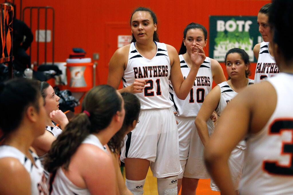 Santa Rosa Panthers point guard Emily Codding, center, talks with her teammates between quarters during a game against the Ukiah Wildcats in Santa Rosa on Tuesday, Feb. 7, 2017. (Alvin Jornada / The Press Democrat)