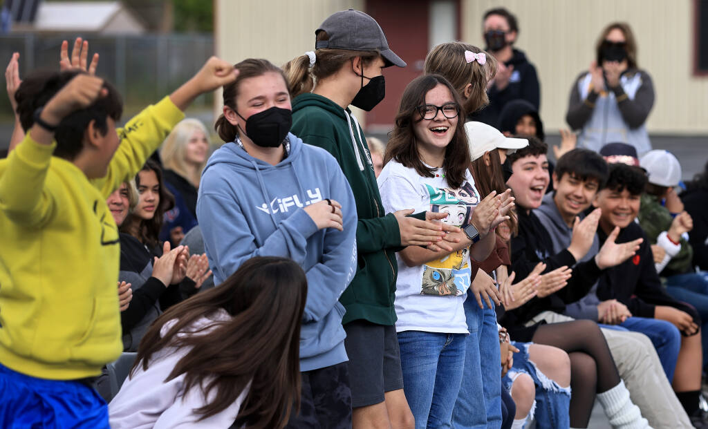 Spring Lake Middle School students cheer after their class was one of two at the school who donated the most supplies for homeless families and youth, Friday, April 22, 2022, in Santa Rosa. (Kent Porter/The Press Democrat)