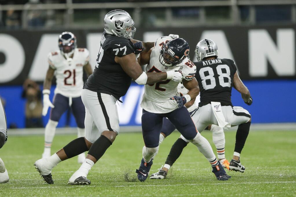 Chicago Bears outside linebacker Khalil Mack, right, is blocked by Oakland Raiders offensive tackle Trent Brown during the second half at Tottenham Hotspur Stadium, Sunday, Oct. 6, 2019, in London. (AP Photo/Tim Ireland)