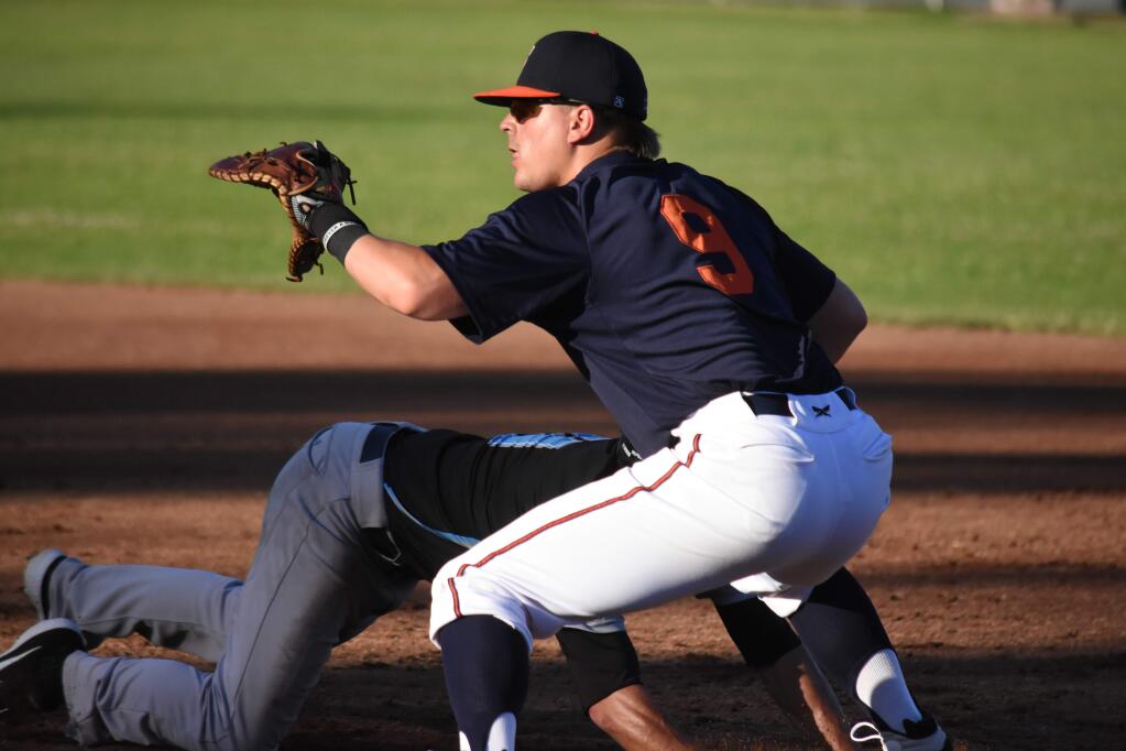Chris Kwitzer (9) holds a Vallejo runner on during play at Arnold Field on Wednesday, June 5. Kwitzer played with the Pittsburg Diamonds last year, hitting .326. (James W. Toy III / Sonoma Stompers)