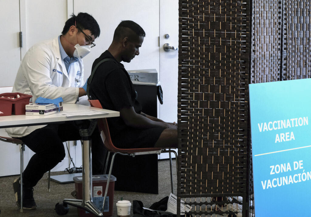 A patient receives a monkeypox vaccination at a pop-up vaccination site at the West Hollywood Library community meeting room on Aug. 3, 2022, in West Hollywood. Photo by Richard Vogel, AP Photo