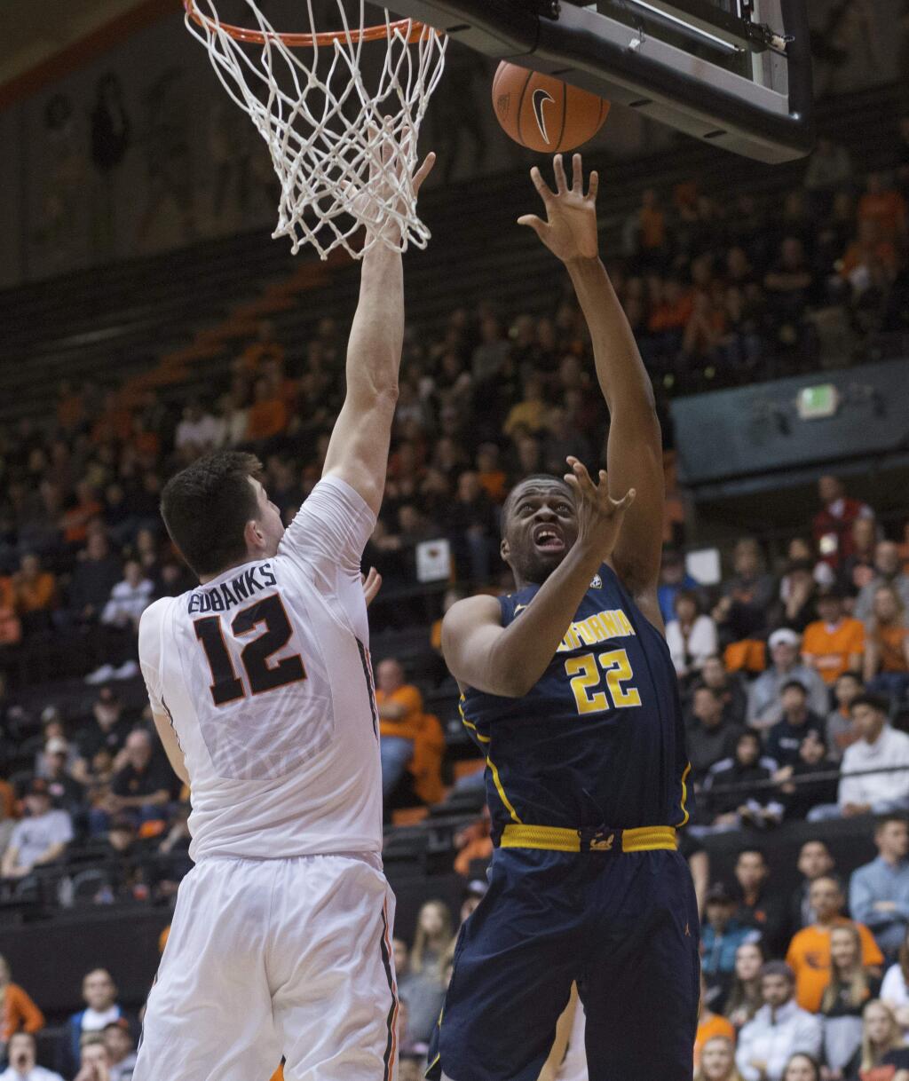California's Kingsley Okoroh (22) gets a shot off while being guarded by Oregon State's Drew Eubanks (12) during the first half of an NCAA college basketball game in Corvallis, Ore., Saturday, Jan. 21, 2017. (AP Photo/Timothy J. Gonzalez)