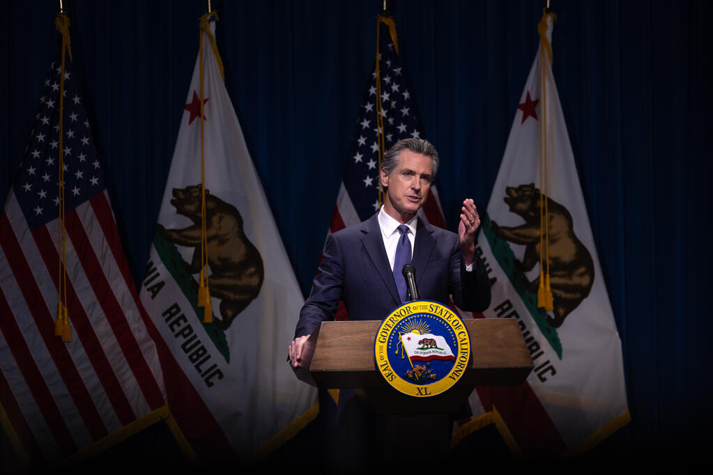 Gov. Gavin Newsom addresses the media during a press conference unveiling his 2024-25 budget proposal at the Secretary of State Auditorium in Sacramento on Jan. 10, 2024. Photo by Miguel Gutierrez Jr., CalMatters