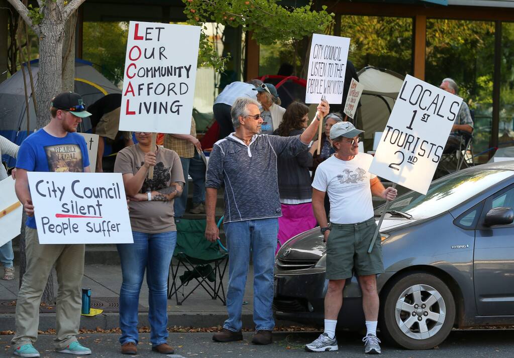 Protesters picket in favor of affordable housing in front of Healdsburg City Hall, where they pitched tents around the entrance, in Healdsburg on Monday, October 5, 2015. (Christopher Chung/ The Press Democrat)
