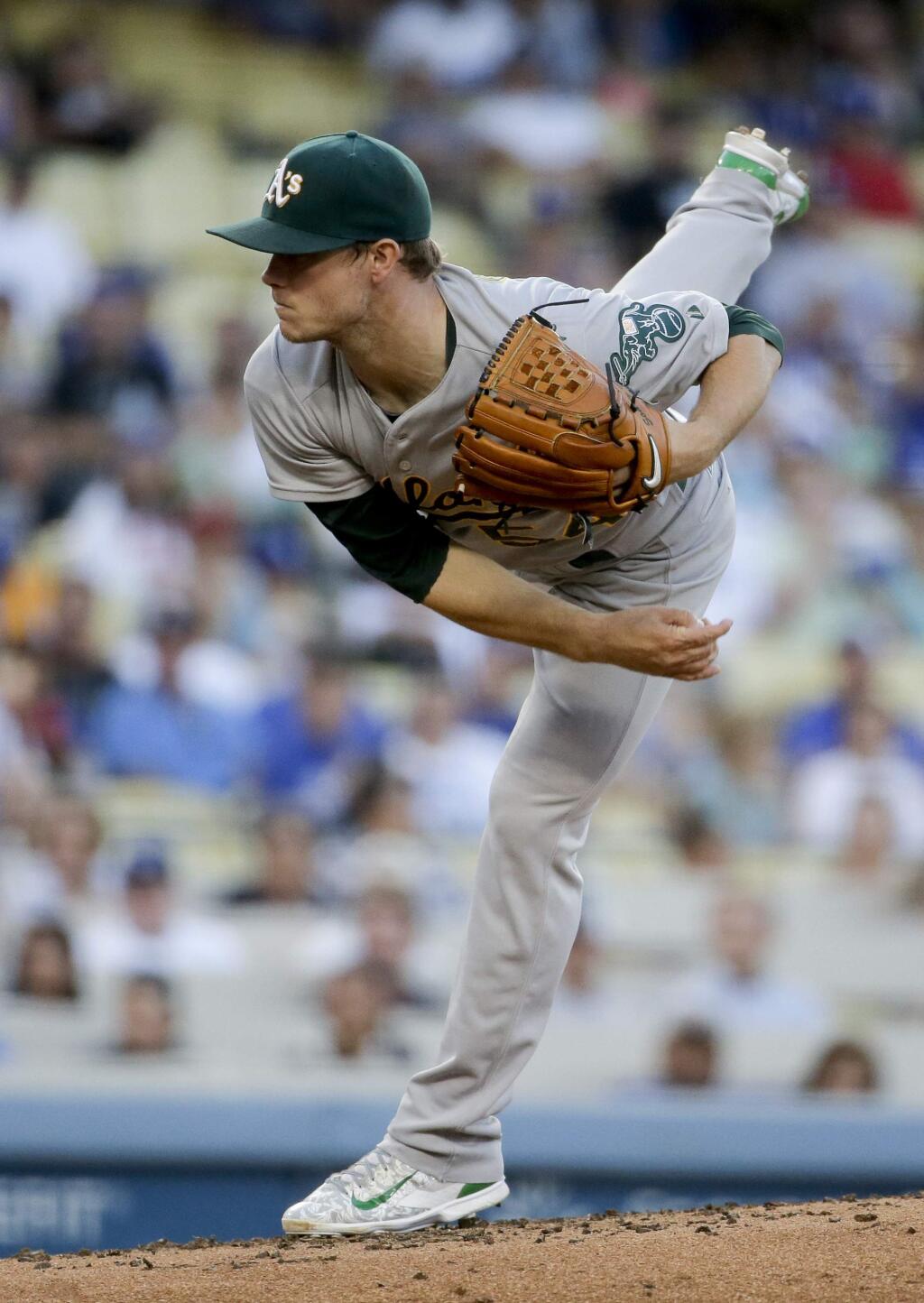 Oakland Athletics starting pitcher Sonny Gray throws against the Los Angeles Dodgers during the first inning of a baseball game in Los Angeles, Tuesday, July 28, 2015. (AP Photo/Chris Carlson)