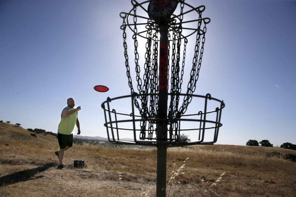 Scott Tanner plays disc golf at Crane Creek Regional Park in June 2018. Sonoma County Regional Parks is offering lessons for beginners interested in learning how to play. (Beth Schlanker / The Press Democrat)