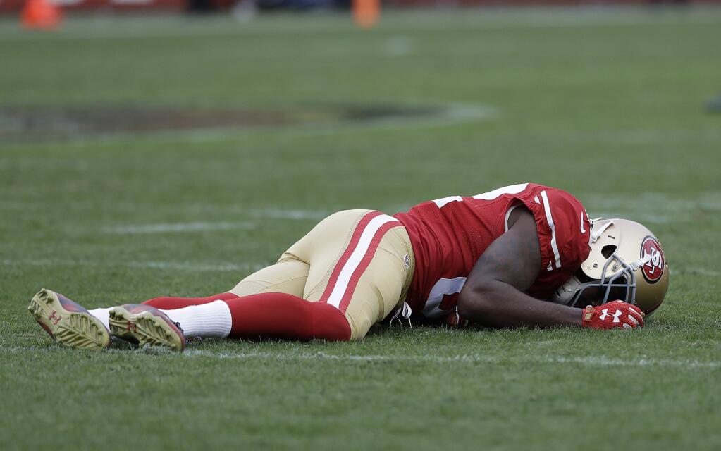 San Francisco 49ers wide receiver Torrey Smith remains on the field during the second half against the New York Jets in Santa Clara, Sunday, Dec. 11. (AP Photo/Marcio Jose Sanchez)