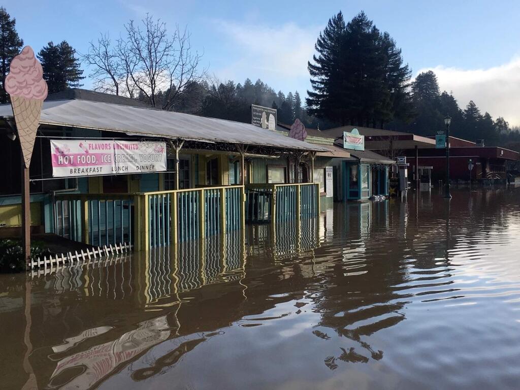 Flooding on Main Street in Guerneville on Thursday, Feb. 28, 2019. (KENT PORTER/ PD)