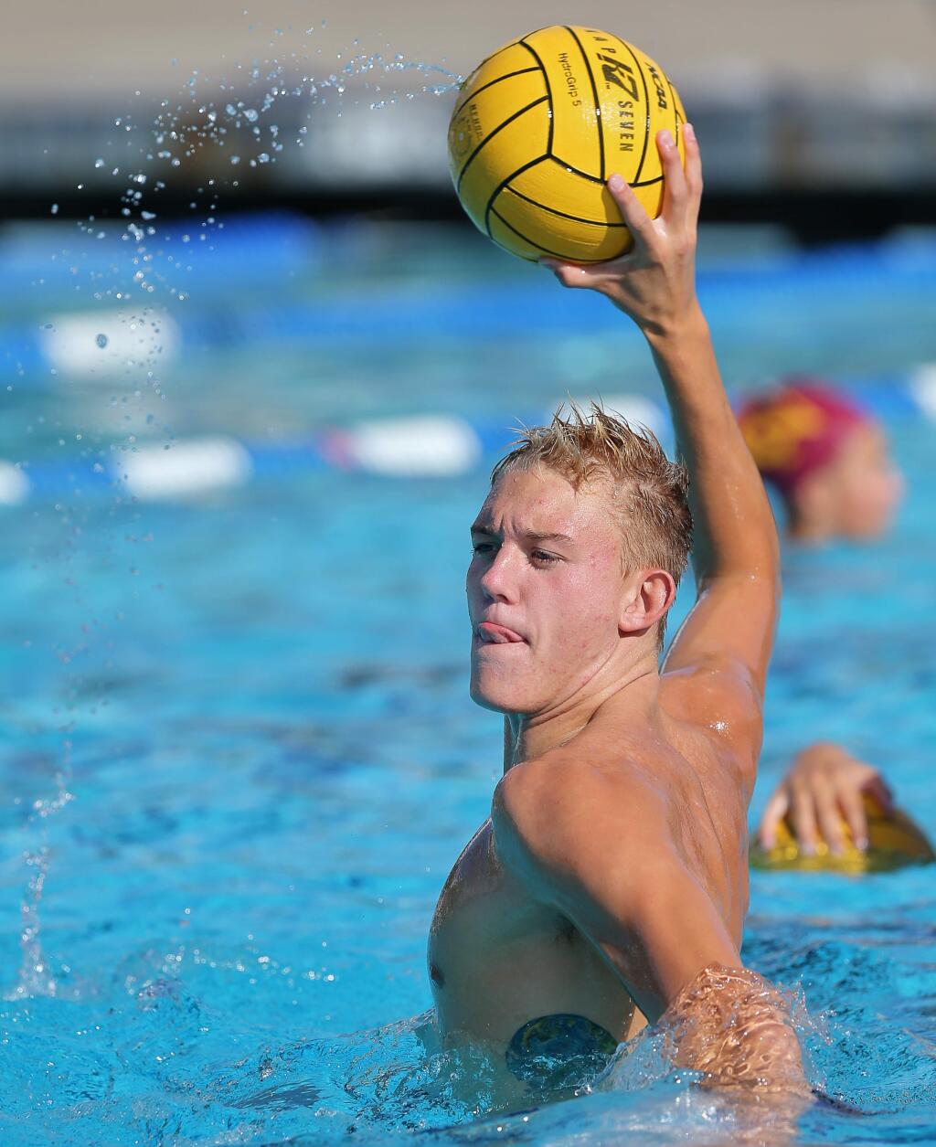 Cardinal Newman water polo player Gavin Homer takes a shot on goal during practice in Santa Rosa on Monday, Sept. 16, 2019. (Christopher Chung / The Press Democrat)