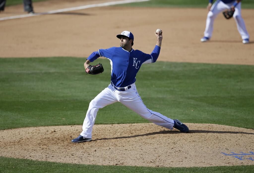 Kansas City Royals' Scott Alexander (73) delivers to the Cincinnati Reds in a spring training baseball game, Tuesday, March 4, 2014, in Surprise, Ariz. (AP Photo/Tony Gutierrez)
