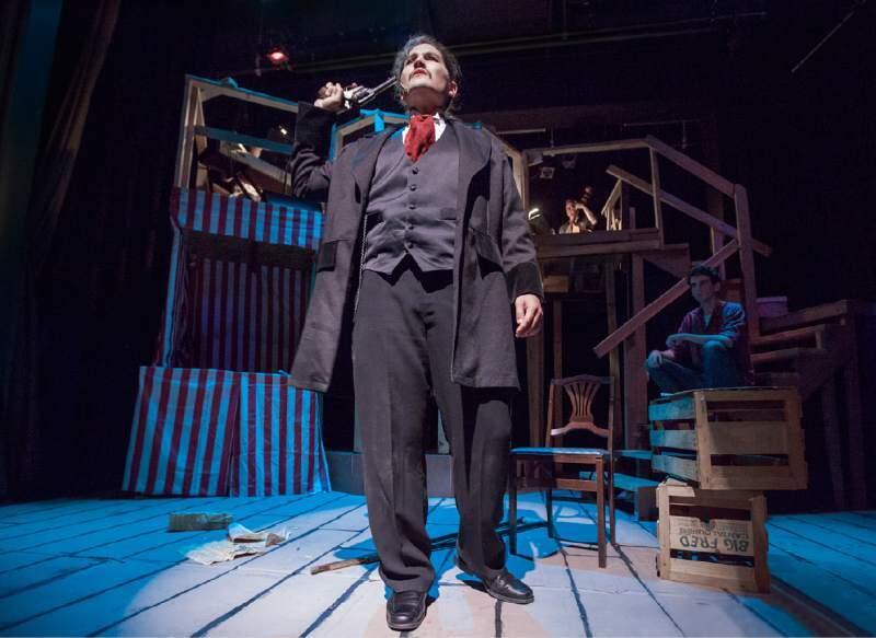 Patrick St. John as John Wilkes Booth in the Marquee Theater Journalists nominated 'Assassins,' nominated for Outstanding Musical Production; seated on stairs is Adam Blankenship, nominated for Outstanding Supporting Performance in a Musical.
