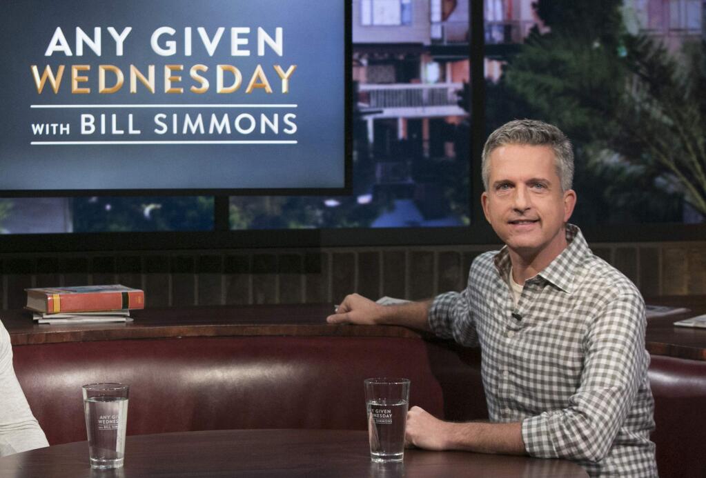 This image released by HBO shows Bill Simmons on the set of 'Any Given Wednesday with Bill Simmons.' HBO canceled the weekly talk show is ending its run after less than five months. The last episode will air on Nov. 9. (Jordin Althaus/HBO via AP)