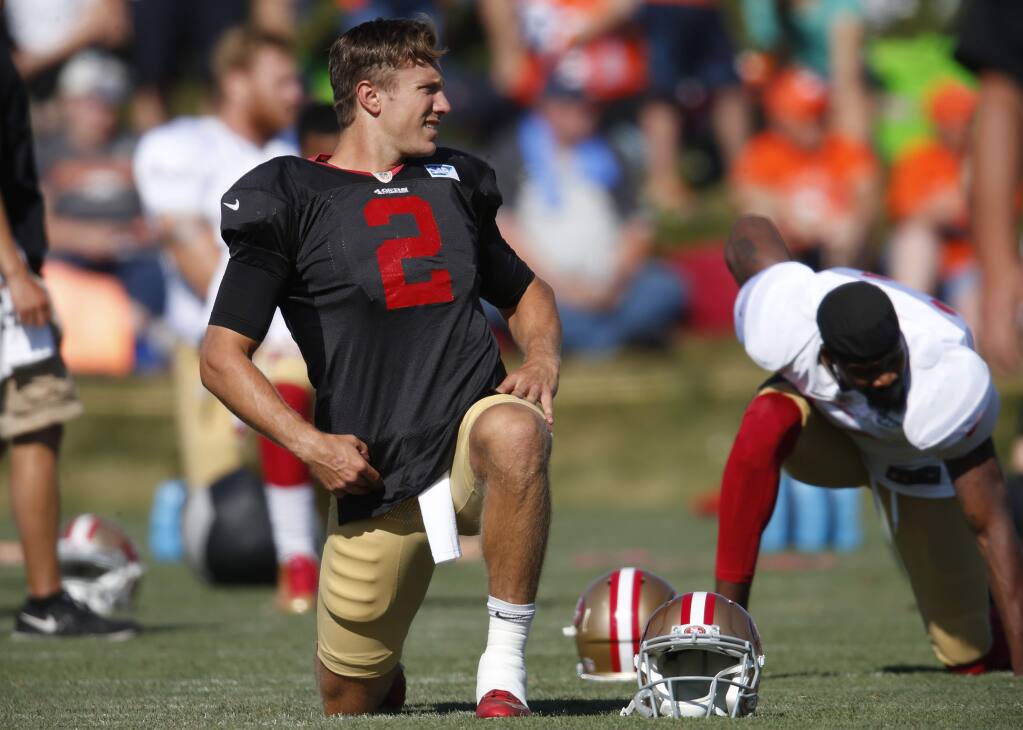 San Francisco 49ers quarterback Blaine Gabbert stretches before taking part in drills against the Denver Broncos at the teams' NFL football training camp session Wednesday, Aug. 17, 2016 in Englewood, Colo. The Broncos host San Francisco on Saturday in an NFL exhibition football contest. (AP Photo/David Zalubowski)
