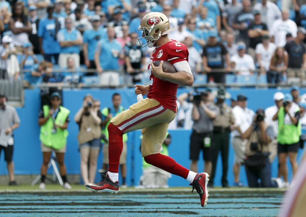 San Francisco 49ers' Blaine Gabbert (2) runs into the end zone for a touchdown against the Carolina Panthers in the second half of an NFL football game in Charlotte, N.C., Sunday, Sept. 18, 2016. (AP Photo/Bob Leverone)