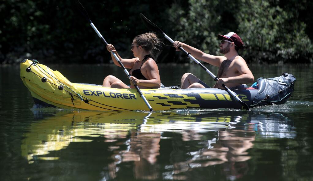 Placid conditions in the Russian River affords an easy paddle upstream near Monte Rio, Thursday, May 23, 2020. (Kent Porter / The Press Democrat) 2020