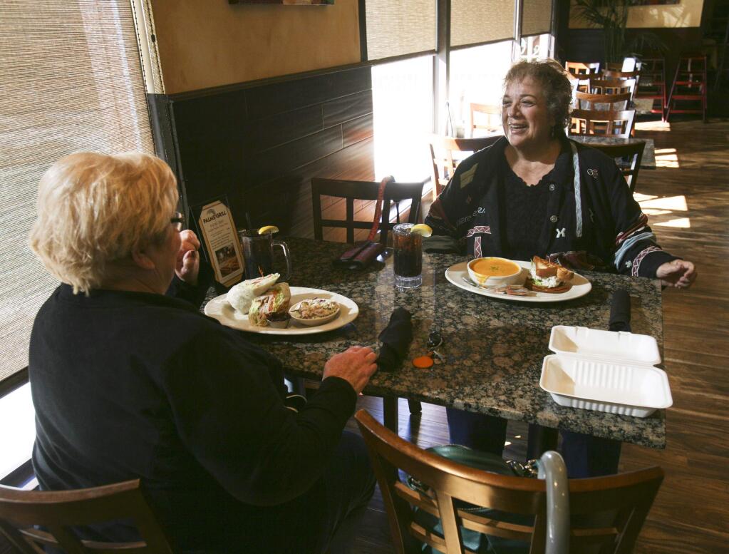Carole Passanisi of Cotati, left, and JoAnn Pelissetti of Petaluma enjoy lunch at Palm's Grill in Petaluma on Monday, November 24, 2014. (SCOTT MANCHESTER/ARGUS-COURIER STAFF)