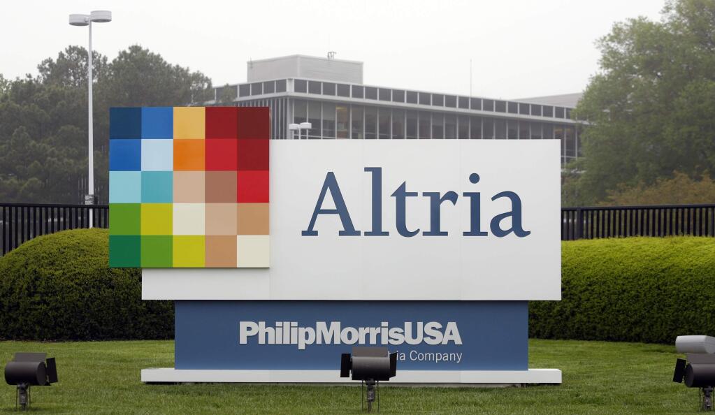 FILE - This April 23, 2008, file photo, shows the Altria Group Inc. corporate headquarters in Richmond, Va. The potential entry of one of the world's largest tobacco companies into the marijuana business is sending the shares of Cronos group rocketing this morning. Cronos is a Canadian cannabis company, which confirmed late Monday, Dec. 3, 2018, that it is in talks with Altria group about a possible investment. (AP Photo/Steve Helber, File)