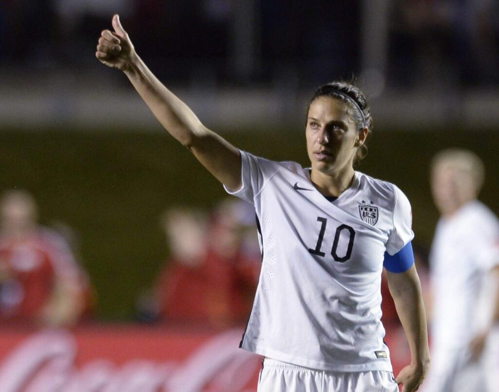 United States' Carli Lloyd (10) looks toward fans after the United States defeatedChina 1-0 in a quarterfinal match in the FIFA Women's World Cup soccer tournament, Friday, June 26, 2015, in Ottawa, Ontario, Canada. (Adrian WyldThe Canadian Press via AP)