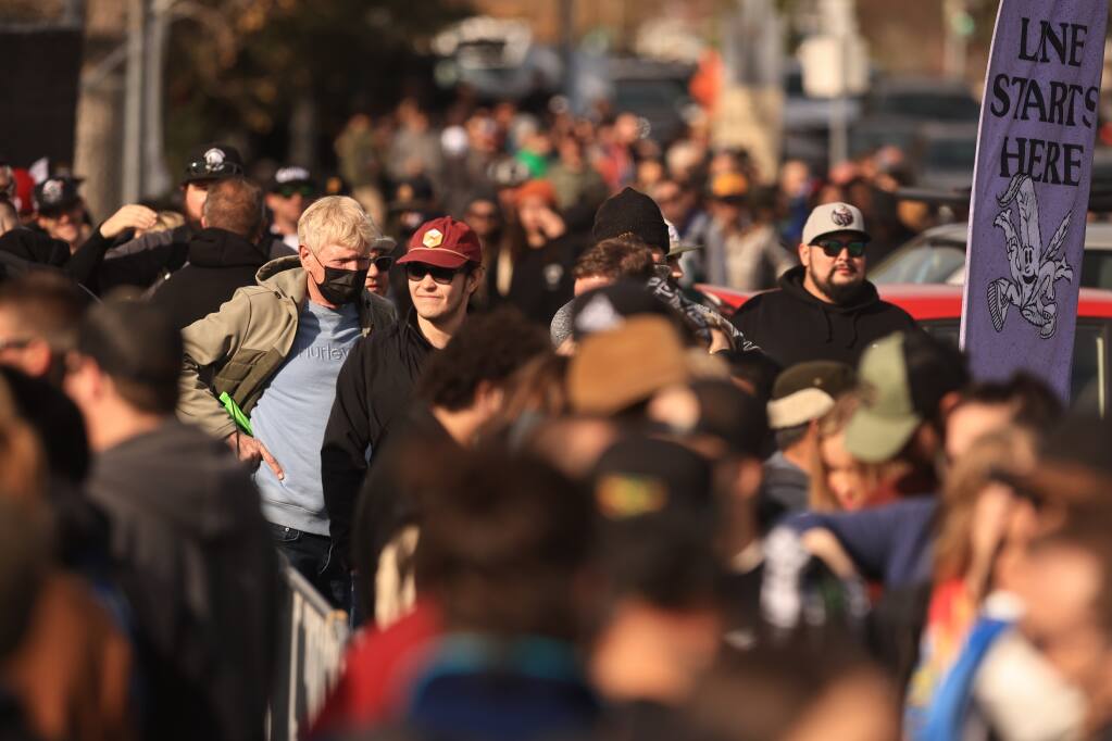 A long line of people wait to get in to the Emerald Cup Harvest Ball, Saturday, Dec. 11, 2021, at the Sonoma County Fairgrounds in Santa Rosa. Assemblyman Jim Wood wants to make it possible for cannabis growers to sell at venues like this.  (Kent Porter / The Press Democrat) 2021