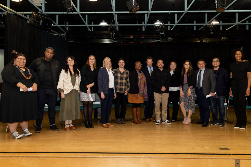 Fourteen of the “23 Sonoma County People to Watch in 2023“ on stage at a Press Democrat event recognizing them at the Petaluma Community Center in Petaluma, Wednesday, Jan. 18, 2023. (Abraham Fuentes/For The Press Democrat)
