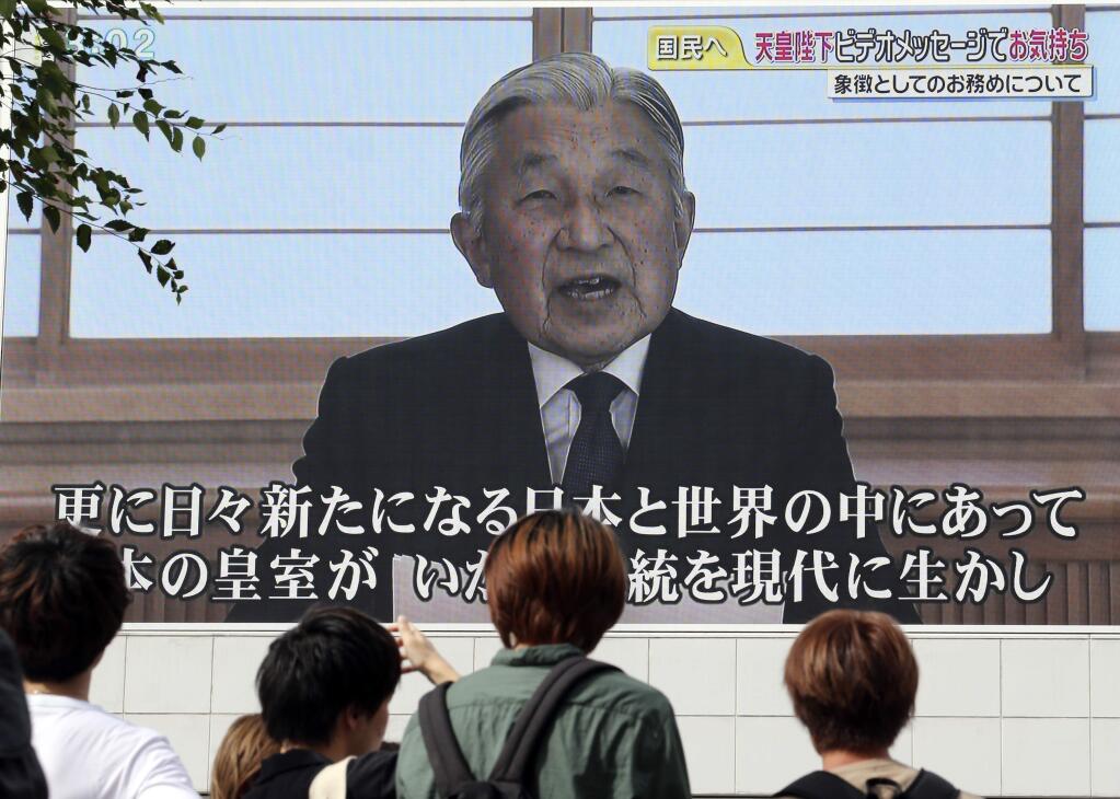 FILE - In this Aug. 8, 2016 file photo, a screen displays Japanese Emperor Akihito delivering a speech in Tokyo. Japan's parliament on Friday, June 9, 2017 passed a law allowing Emperor Akihito to become the first monarch to abdicate in 200 years. (AP Photo/Koji Sasahara, File)