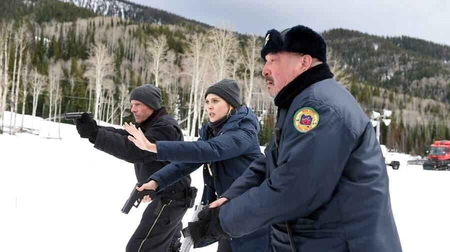FBI agent Jane Banner (Elizabeth Olson, center) works with local police (Graham Greene, right, Hugh Dillon) to figure out what happened on an Indian reservation.