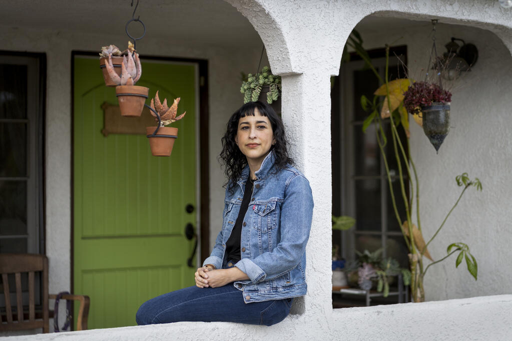 Angela Vázquez, shown at her home in Mount Washington in Los Angeles, has been suffering from symptoms of long COVID for almost two years. Photo by Lauren Justice for CalMatters