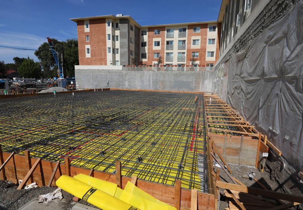 The Art House, currently under construction on the corner of 7th and Riley streets in Santa Rosa, will feature 21 apartments, 15 extended stay suites, a wine lobby, and an art gallery.(Christopher Chung/ The Press Democrat)