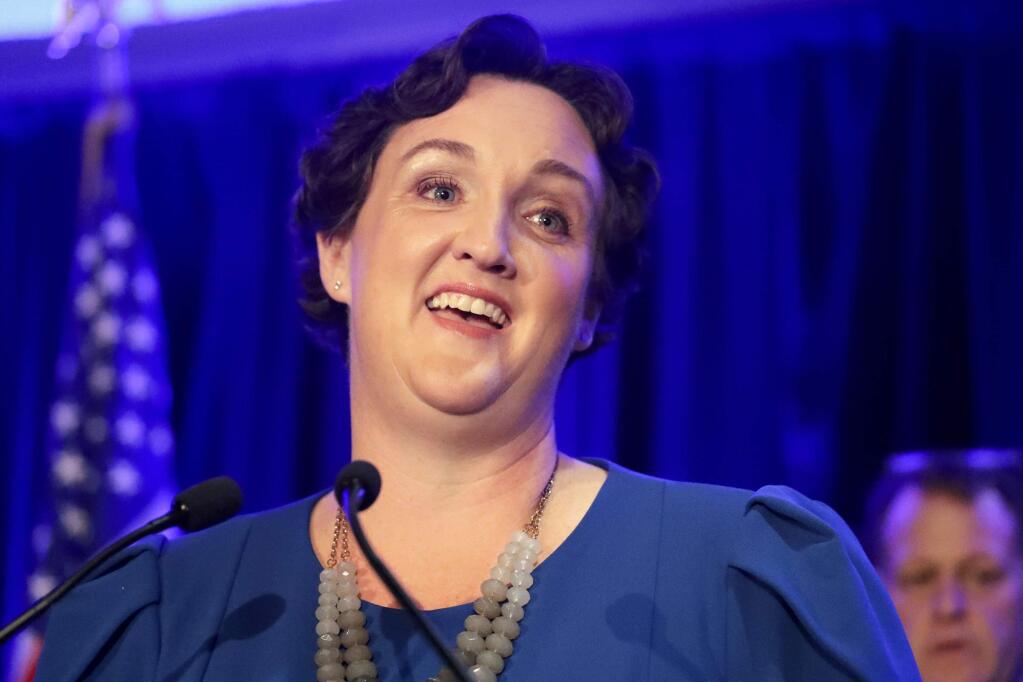 FILE - In this Nov. 6, 2018 file photo, Democratic congressional candidate Katie Porter speaks during an election night event in Tustin, Calif. Porter says she supports an impeachment investigation of President Donald Trump, adding another Democratic lawmaker to those clamoring for the move. (AP Photo/Chris Carlson, File)