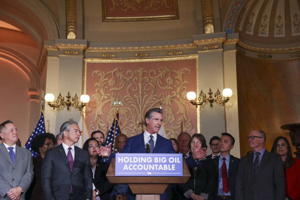 Gov. Gavin Newsom speaks at an event before signing into law his oil profit penalty plan in Sacramento on March 28, 2023. Photo by Miguel Gutierrez Jr. , CalMatters
