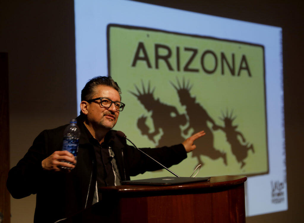 Cartoonist Lalo Alcaraz speaks about his work in front of middle and high school students during the MEChA, Movimiento Estudiantil Chicano de Aztlán, Youth conference at the Santa Rosa Junior College in Santa Rosa, California  on Friday, April 19, 2019. (BETH SCHLANKER/The Press Democrat)