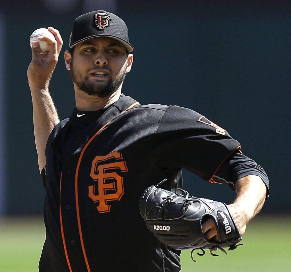 The San Francisco Giants' Tyler Beede works against the Oakland Athletics in the first inning Saturday, April 1, 2017, in Oakland. (AP Photo/Ben Margot)