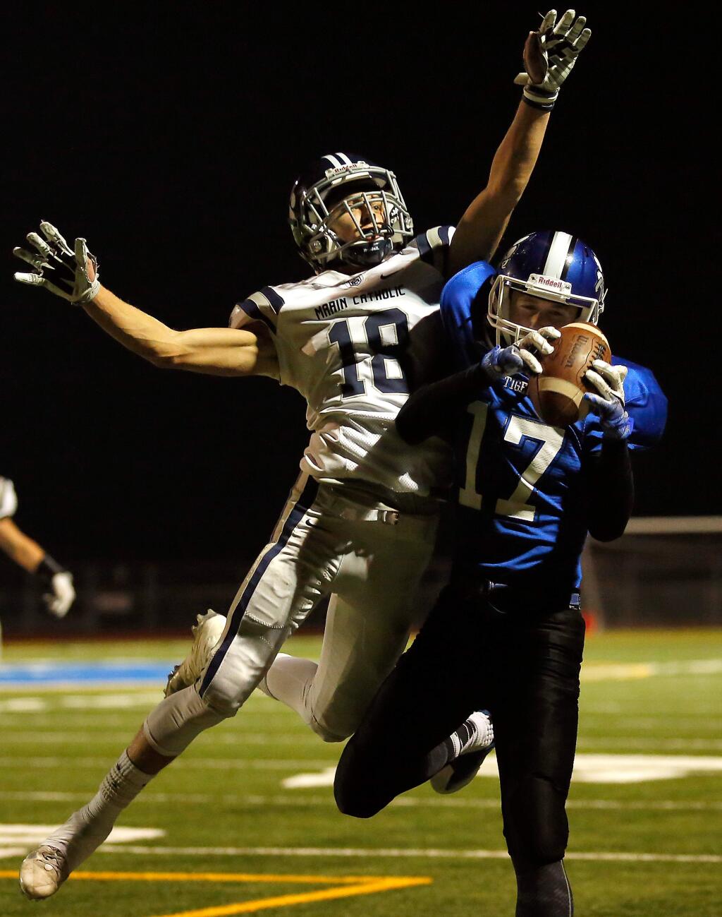 Analy's Ross Simmons (17), right, pulls in a touchdown catch in front of Marin Catholic's Liam Oprendek (18) during the first half of the NCS Division 3 playoff game on Friday, Nov. 25, 2016. (Alvin Jornada / The Press Democrat)