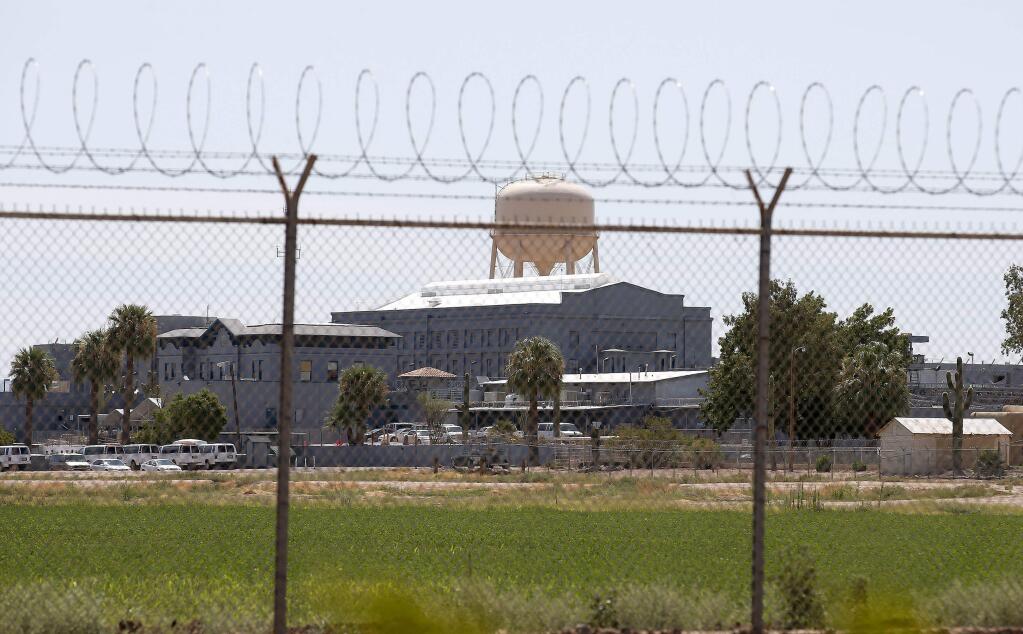 A fence surrounds the state prison in Florence, Ariz. where the execution of Joseph Rudolph Wood took place on Wednesday, July 23, 2014. (AP Photo)