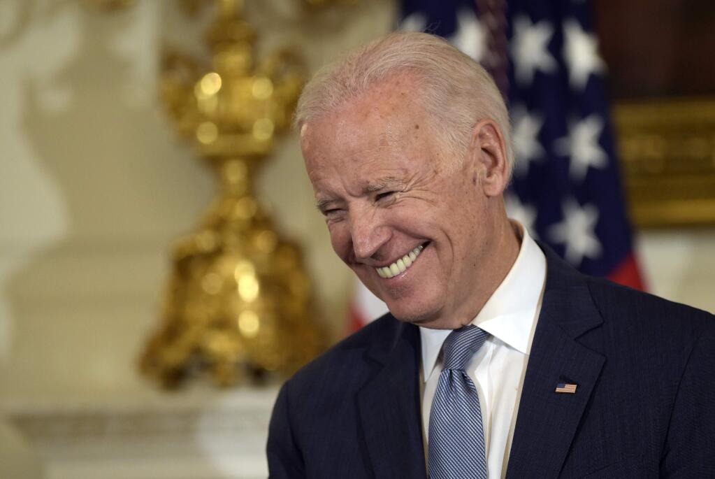 Vice President Joe Biden smiles during a ceremony in the State Dining Room of the White House in Washington, Thursday, Jan. 12, 2017, where President Barack Obama presented him with the Presidential Medal of Freedom. (AP Photo/Susan Walsh)