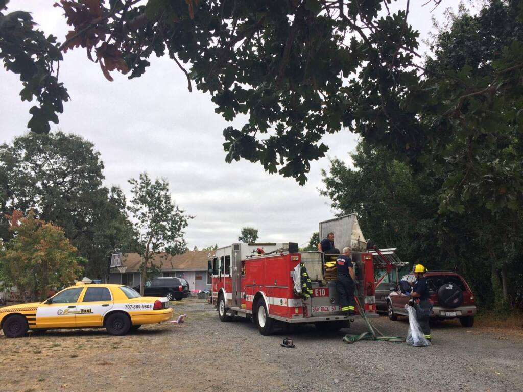 Fire crews respond to a house fire on Chico Avenue in Santa Rosa on Monday, Aug. 25, 2014. (PD STAFF)