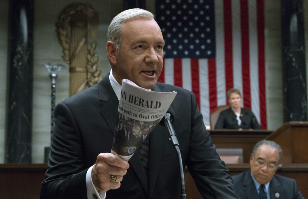 This image released by Netflix shows Kevin Spacey in a scene from 'House Of Cards.' Netflix says it's suspending production on 'House of Cards' following harassment allegations against Spacey. (David Giesbrecht/Netflix via AP)