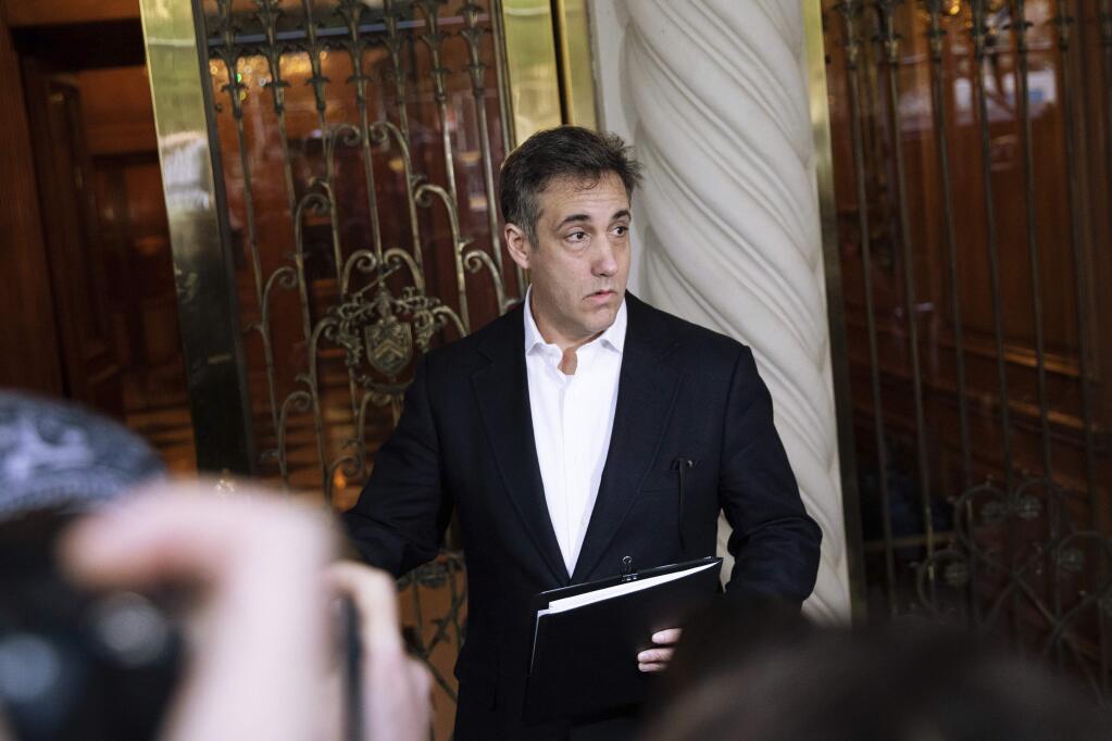 FILE - In this May 6, 2019, file photo Michael Cohen, former attorney to President Donald Trump, holds a press conference outside his apartment building before departing to begin his prison term in New York. Cohen will be released from federal prison on Thursday, May 21, 2020, and is expected to serve the remainder of his sentence at home, a person familiar with the matter told The Associated Press. (AP Photo/Kevin Hagen, File)