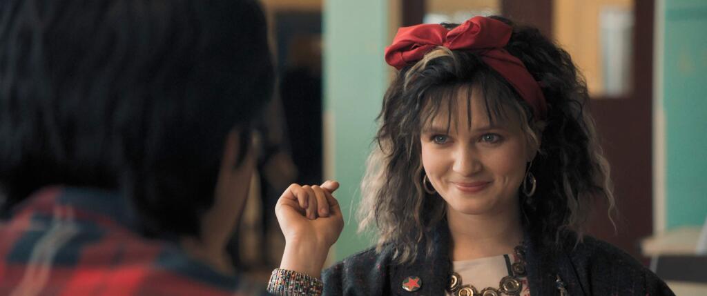 This image provided by Warner Bros. Entertainment Inc. shows Nell Williams in a scene from Warner Bros.' “Blinded by the Light,” which is about a young Pakistani-British teen in 1980s Britain whose life is transformed when a friend introduces him to Bruce Springsteen's music. (Warner Bros. Entertainment Inc. via AP)